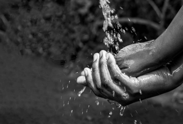 Washing hands with running water and soap. For hygiene and covid-19 prevention concepts. - Photo, Image
