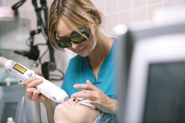 Woman having a laser skin treatment - Photo, Image