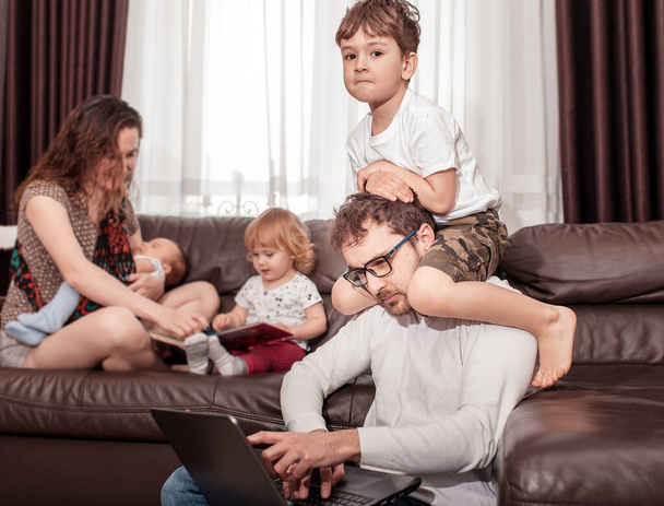 Father works at home. Full family stay home. Father freelancer try to work at home with children. - Fotoğraf, Görsel