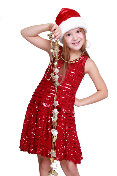 Little girl holding christmas golden stars - Фото, зображення