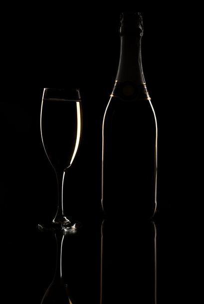 Champagne glass over black background - Foto, afbeelding