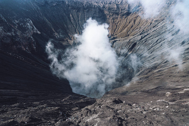 Photo of smoke volcano crater on Java island in Indonesia - Photo, image