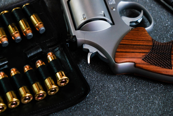 Revolver metal 0,44 0,357 magnum gun with jacket soft point bullet close up - Photo, image