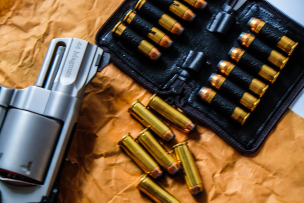 Revolver metal 0,44 0,357 magnum gun with jacket soft point bullet close up - Photo, image