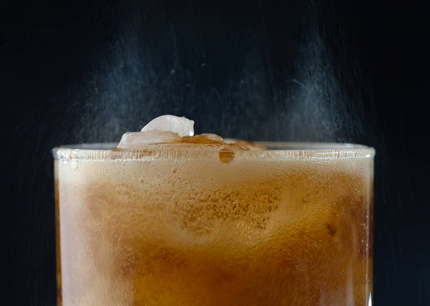 ice cube in fizzy splashing water with soda bubble - Photo, Image