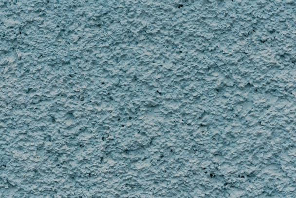 textura de la pared de estuco azul con tubérculos
 - Foto, imagen