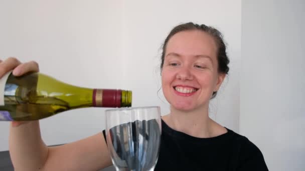 Woman talking on a webcam with wine - Materiał filmowy, wideo