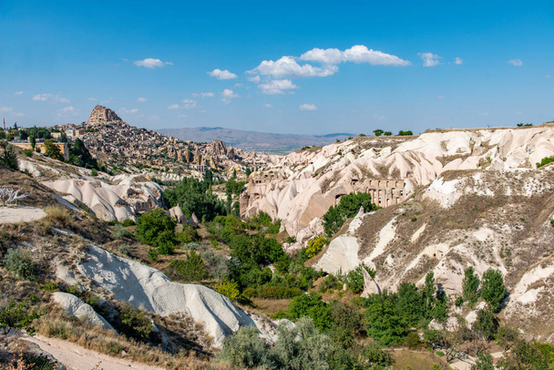 Rocks looking like mushrooms dramatically  in Cappadocia, Turkey This photo was shot from Cappadocia which located in the center of Turkey. Cappadocia is an ancient region of Anatolia.  - Fotografie, Obrázek