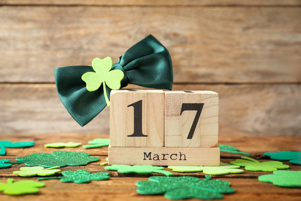 Composition with block calendar on wooden table. St. Patrick's Day celebration - Foto, afbeelding