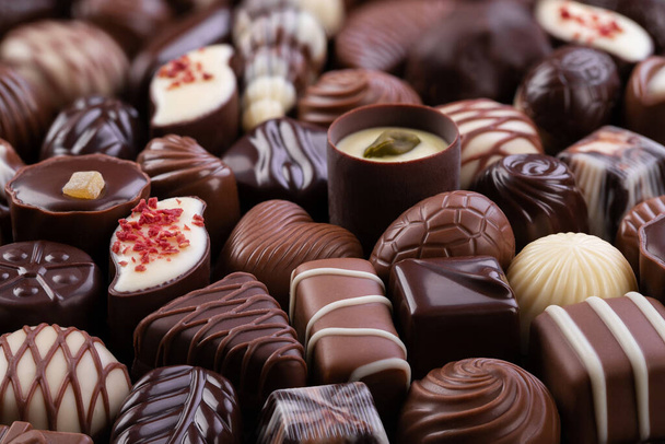 mix chocolate candy and other sweetmeat, dessert food background - Photo, Image