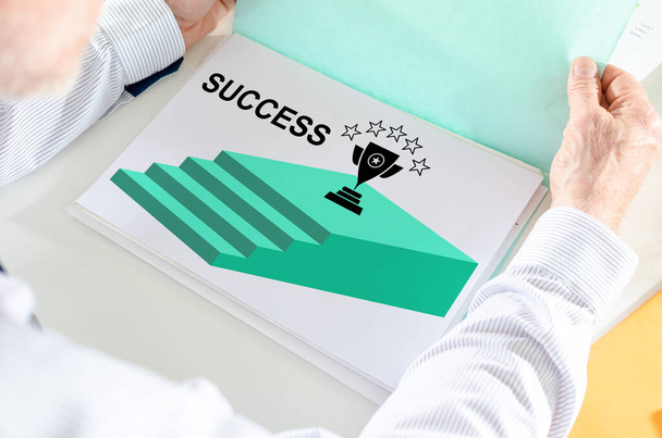 Man holding a file with success concept - Photo, Image