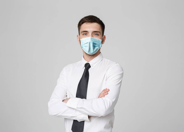 Business Concept - Portrait Handsome Businessman in face mask holding hands with confident face. White Background. - Foto, Imagen