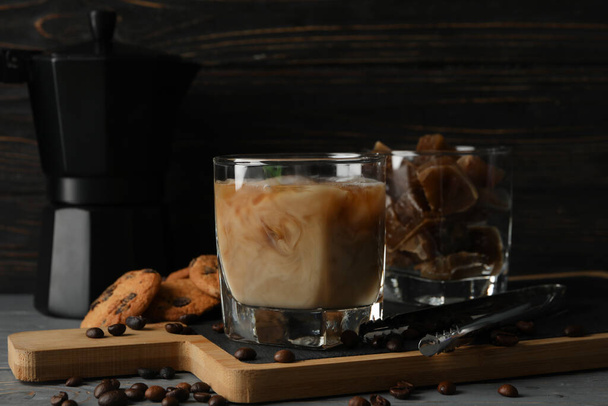 Composition with ice coffee and cookies on wooden background - Photo, Image