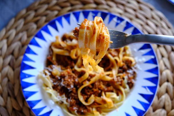 Tagliatelle Bolognese - long, flat egg pasta with a meat sauce or Bolognese sauce. - Photo, Image
