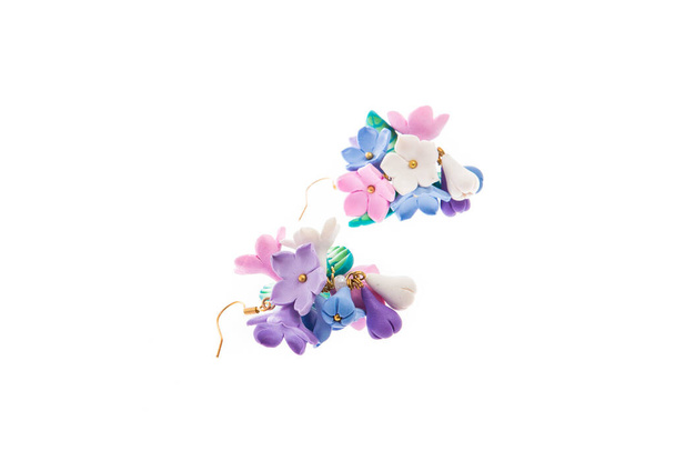 Handmade lilac flower shaped earrings isolated on white background. Female accessories, decorative ornaments and jewelry. Fashion and style concept. - Photo, Image
