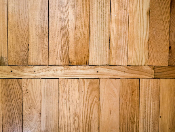 Wooden brown parquet on the floor, wood texture - Fotó, kép