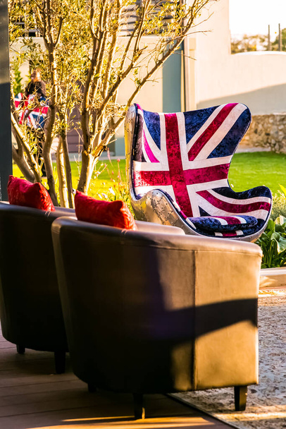 Union Jack British Flag couch with suspended chandelier at outdoor corporate event - Photo, image