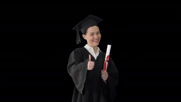 Mujer graduada feliz sosteniendo diploma y pulgar hacia arriba, Alpha Channel - Metraje, vídeo