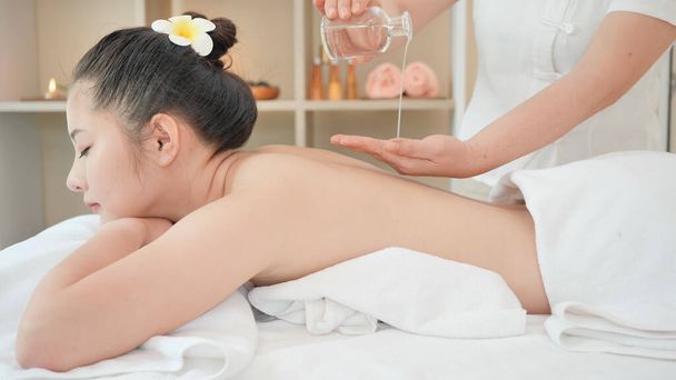 https://cdn.create.vista.com/api/media/small/368578180/stock-photo-young-asian-woman-getting-relaxing-oil-massage-beauty-spa-salon