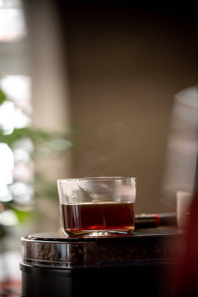 Glass of black filter coffee hario pour over sunlight daylight coffee house cafe side view - 写真・画像