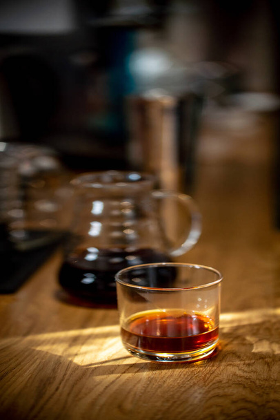 Pour over black coffee hario on table coffee house cafe serving kettle side view - 写真・画像