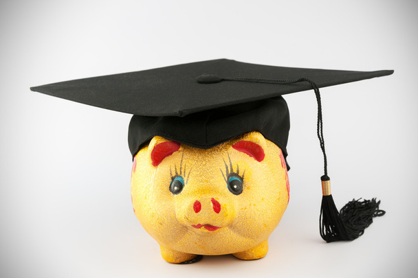 卒業の帽子と貯金箱 - 写真・画像