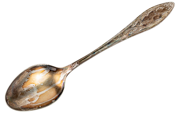 cuchara de cuproníquel vieja con capa de oxidación visible aislada sobre fondo blanco
 - Foto, Imagen