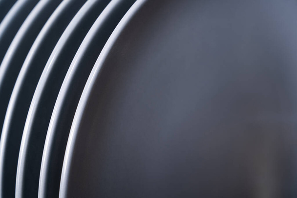 Clean gray plates in dishwasher closeup. Studio shot. - Fotó, kép