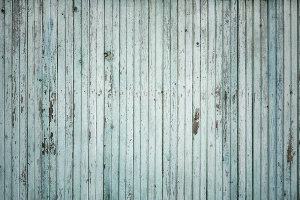 Old green wooden fence. Wall textured background. - 写真・画像