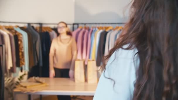 fashion boutique woman clothes shopping bags - Video, Çekim