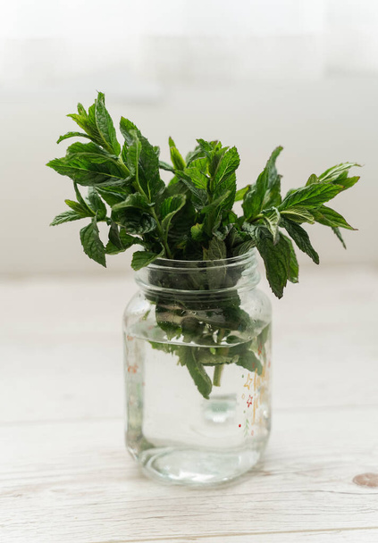 mint in a transparent glass. Healthy eating concept. - Foto, imagen