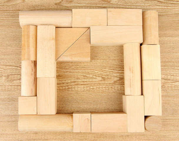 Wooden toy blocks on wooden background - Fotografie, Obrázek