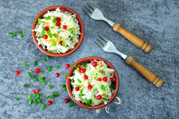 Sauerkraut. Fermented products for health. Sauerkraut with cranberries and spring onions. Probiotics. - Photo, Image