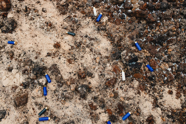 Weapons and military equipment. used ammunition cartridges on a soil. 12 mm - Photo, Image
