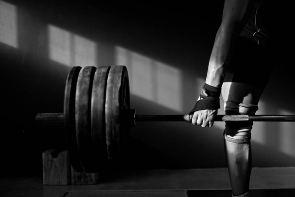 photo of a Man practising weightlifting - Valokuva, kuva