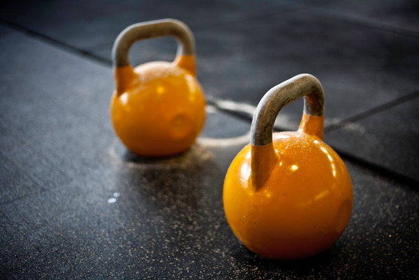 kettlebell on the floor in a croosfit gym - Photo, Image