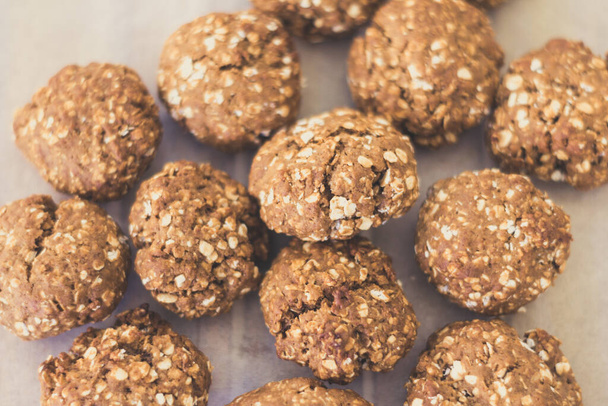 topview of homemade oat cookies on bakery paper - Photo, Image