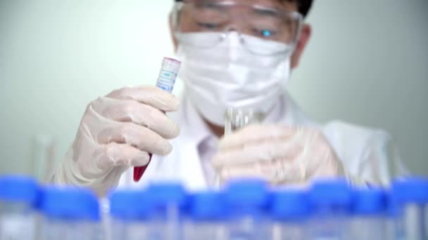 Asian male researcher working in the laboratory. - Felvétel, videó