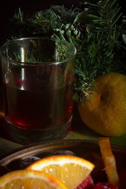 Wine and tangerines on a New Year's table - Фото, зображення