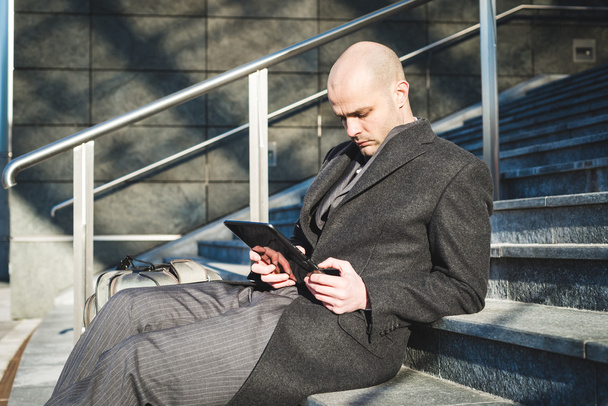 successful elegant fashionable businessman using tablet - Photo, Image