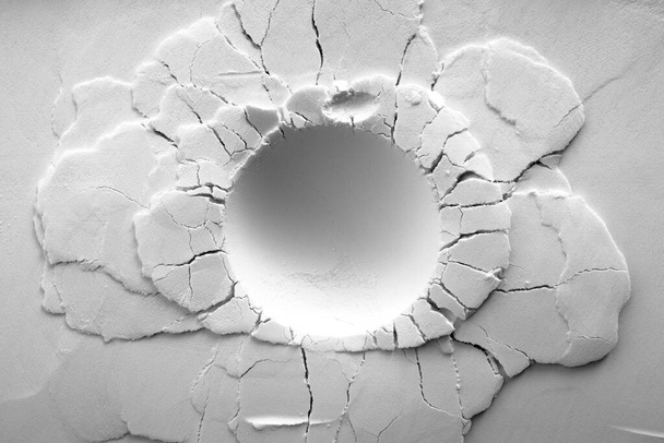 A crater on white powder background. Round crater with cracks.    - Photo, Image
