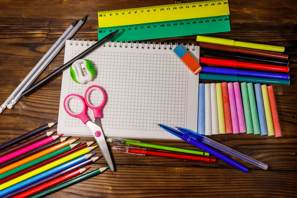 Set of school stationery supplies on wooden desk. Back to school concept - Foto, afbeelding