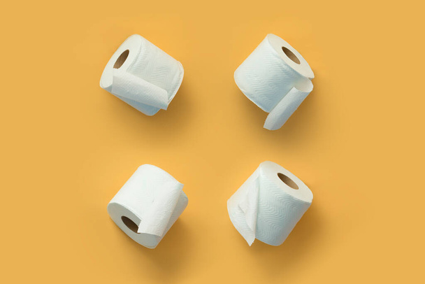 Toilet rolls pattern on orange background. flat lay view - Photo, Image