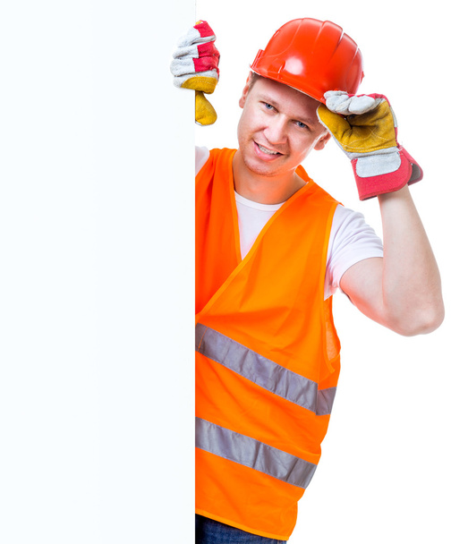 working man holding a white blank - Foto, afbeelding