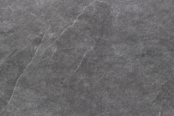 Black rough stone surface. Texture background. - Photo, image