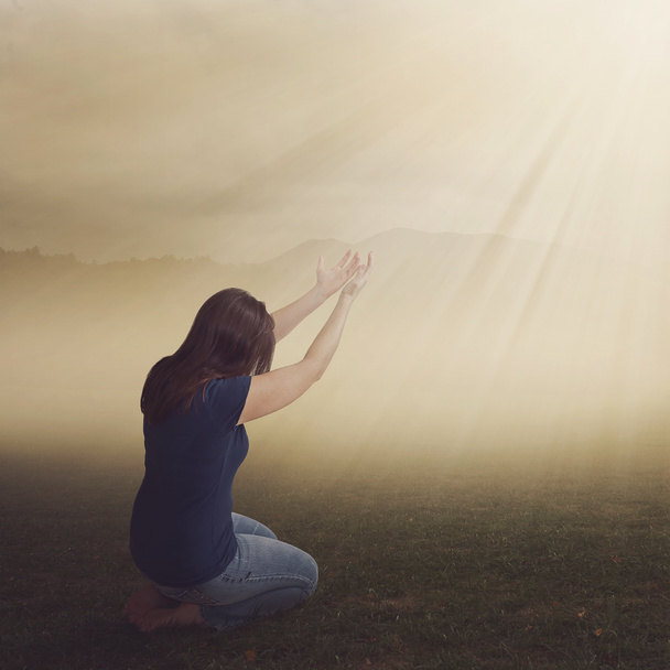 Woman in field in worship - Photo, Image