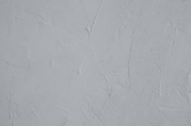 A close-up of the surface is gtey with plaster texture. Horizontal orientation, selective focus.  - Photo, Image