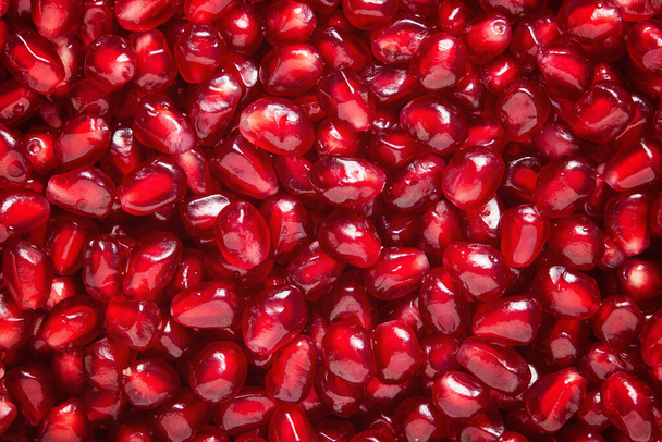 A lot of fresh pomegranate seeds viewed from above - Fotó, kép