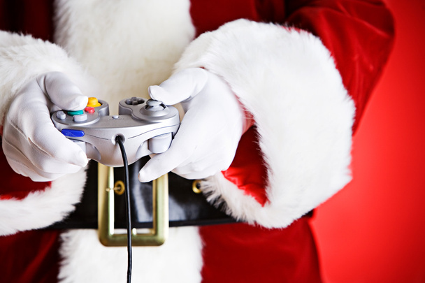 Santa: Playing a Video Game - Foto, afbeelding