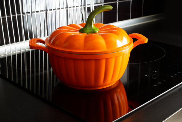 pumpkin pan on stove in the kitchen - Valokuva, kuva
